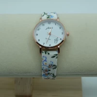 OROLOGIO CON CINGHIA BIANCA CON FIORI E QUADRANTE BIANCO