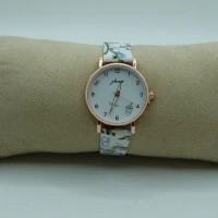 OROLOGIO CON CINGHIA BIANCA CON FIORI E QUADRANTE BIANCO