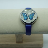 OROLOGIO CON CINGHIA BLU E QUADRANTE CON FARFALLA BLU