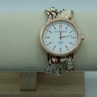 OROLOGIO CON CINGHIA IN TESSUTO PANNA CON FIORI E QUADRANTE BIANCO