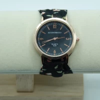 OROLOGIO CON CINGHIA IN TESSUTO NERO CON FIORI E QUADRANTE BIANCO