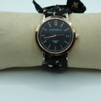 OROLOGIO CON CINGHIA IN TESSUTO NERO CON FIORI E QUADRANTE BIANCO
