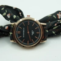OROLOGIO CON CINGHIA IN TESSUTO NERO CON FIORI E QUADRANTE BIANCO