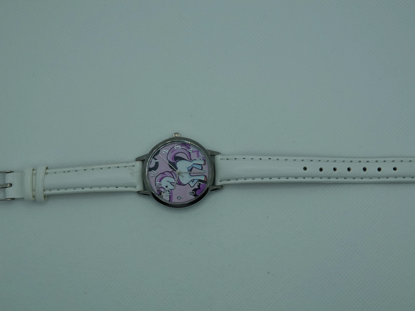 OROLOGIO CON CINGHIA BIANCA E QUADRANTE UNICORNO
